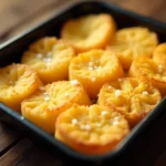 Frozen hash browns arranged in a baking tray ready for the oven